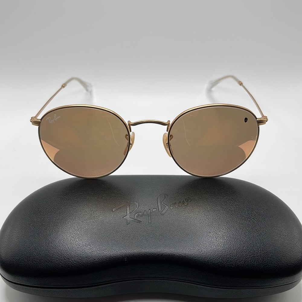 Women’s Ray Ban sunglasses. Round gold metal frames with rose and brown lenses.